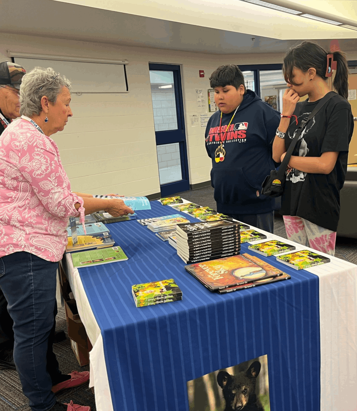 Students looking at books